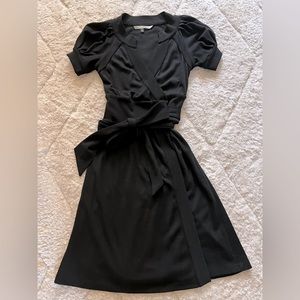 Diane Von Furstenberg black short sleeve wrap dress.